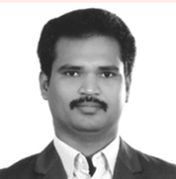Packiaraj Pandi, in a dark suit and tie, photographed head-on in black and white.
